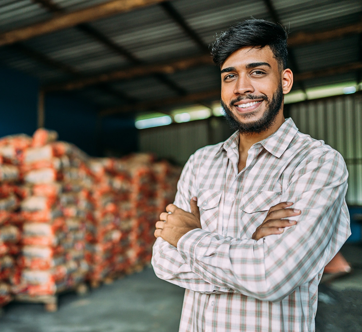 Farmer using mobile phone in field with notification overlay